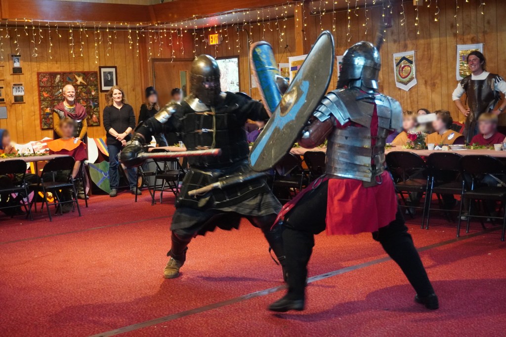 Heavy fighters John Latson and Ben Ward demonstrate perfect form at Siskiyou School in Ashland, Oregon. April 16, 2026. Kids' faces are blurred for identity protection.
