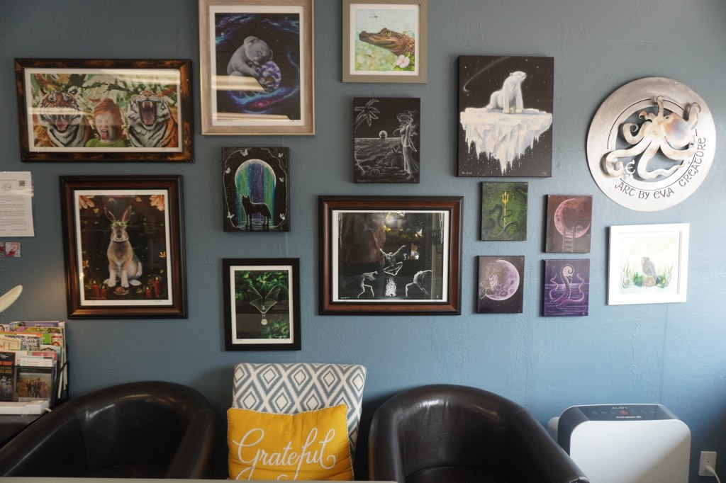 a picture of the photos on the wall at THINK and sitting space